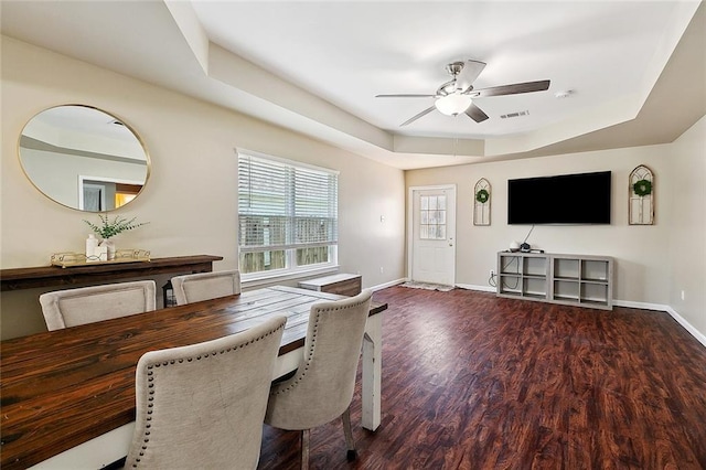 5926 Tullis Dr, New Orleans, LA 70131 - dining area featuring a ceiling fan, baseboards, wood finished floors, and a raised ceiling