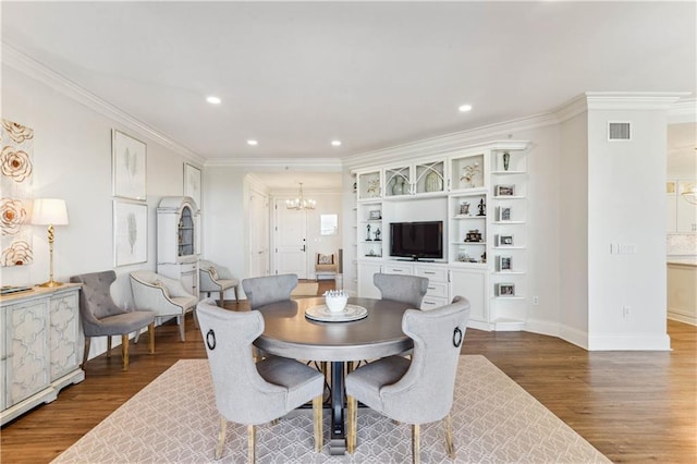 232 Lake Marina Ave Unit 10-D, New Orleans, LA 70124 - dining room featuring a chandelier, wood finished floors, ornamental molding, recessed lighting, and baseboards