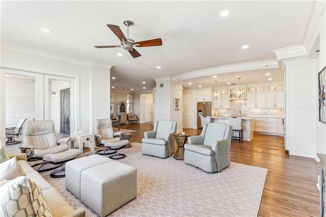 232 Lake Marina Ave Unit 10-D, New Orleans, LA 70124 - living room with ornamental molding, a ceiling fan, recessed lighting, light wood-style floors, and french doors