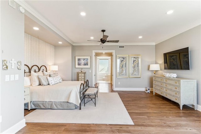 232 Lake Marina Ave Unit 10-D, New Orleans, LA 70124 - bedroom with ornamental molding, wood finished floors, recessed lighting, baseboards, and ensuite bath