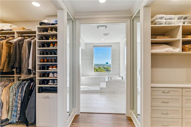 232 Lake Marina Ave Unit 10-D, New Orleans, LA 70124 - spacious closet with wood finished floors