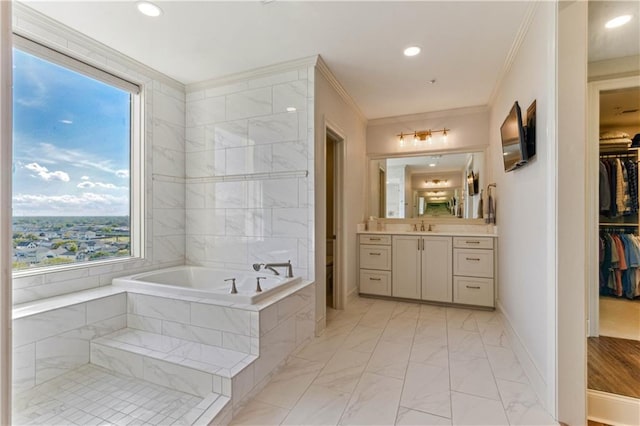 232 Lake Marina Ave Unit 10-D, New Orleans, LA 70124 - bathroom with marble finish flooring, a bath, vanity, a spacious closet, and ornamental molding