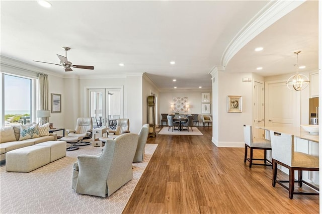 232 Lake Marina Ave Unit 10-D, New Orleans, LA 70124 - living room with recessed lighting, ornamental molding, wood finished floors, baseboards, and a ceiling fan