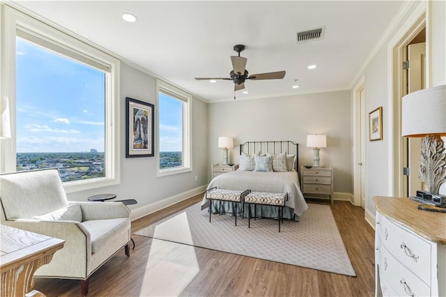 232 Lake Marina Ave Unit 10-D, New Orleans, LA 70124 - bedroom with baseboards, crown molding, wood finished floors, a ceiling fan, and recessed lighting
