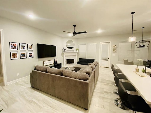 1758 Mary Dr, Slidell, LA 70458 - living room with a ceiling fan, a fireplace, and baseboards