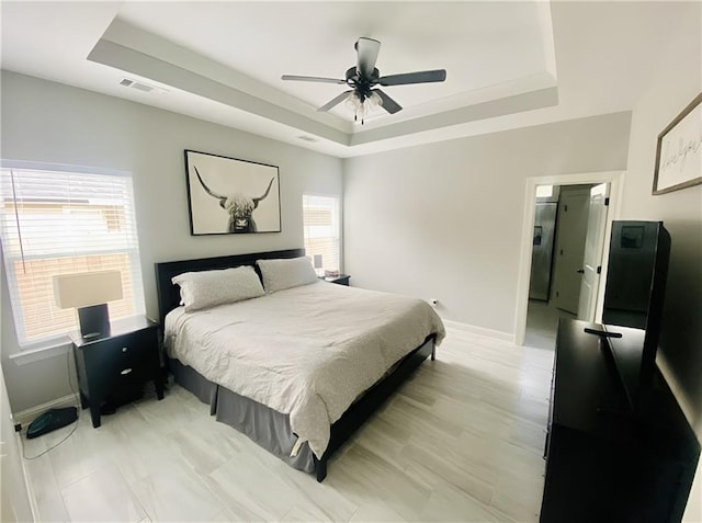 1758 Mary Dr, Slidell, LA 70458 - bedroom with a raised ceiling, baseboards, and a ceiling fan