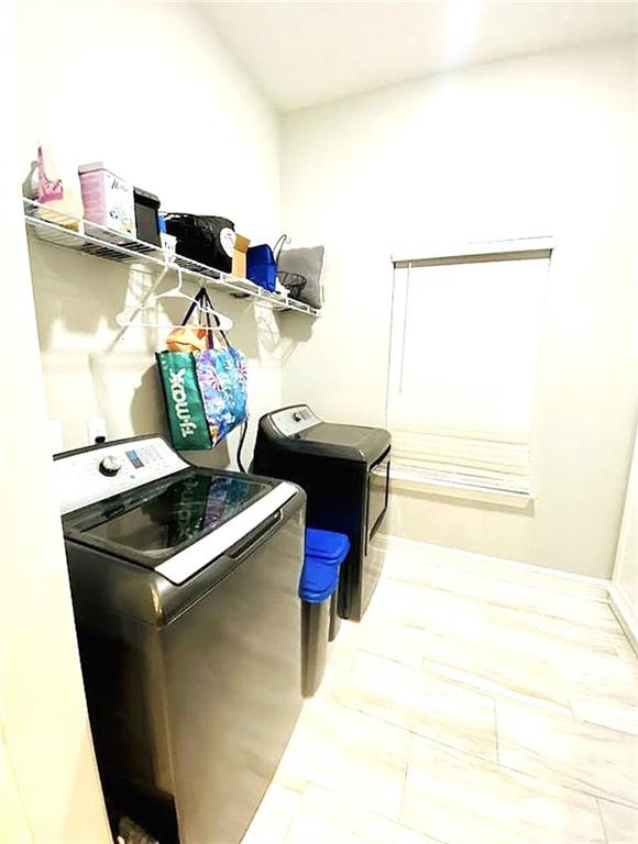1758 Mary Dr, Slidell, LA 70458 - laundry area featuring washing machine and dryer