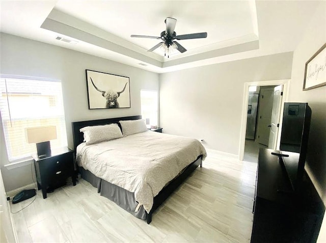 1758 Mary Dr, Slidell, LA 70458 - bedroom featuring a raised ceiling, baseboards, and a ceiling fan