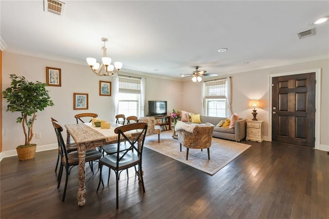 5517 N Rampart St, New Orleans, LA 70117 - dining area with dark wood-style flooring, a chandelier, crown molding, baseboards, and recessed lighting