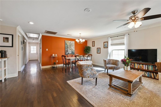 5517 N Rampart St, New Orleans, LA 70117 - living area with crown molding, wood finished floors, baseboards, attic access, and ceiling fan