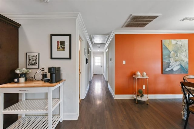 5517 N Rampart St, New Orleans, LA 70117 - corridor featuring attic access, wood finished floors, baseboards, and ornamental molding