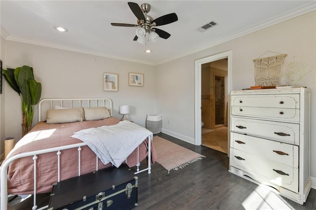 5517 N Rampart St, New Orleans, LA 70117 - bedroom featuring crown molding, dark wood-style floors, baseboards, recessed lighting, and connected bathroom