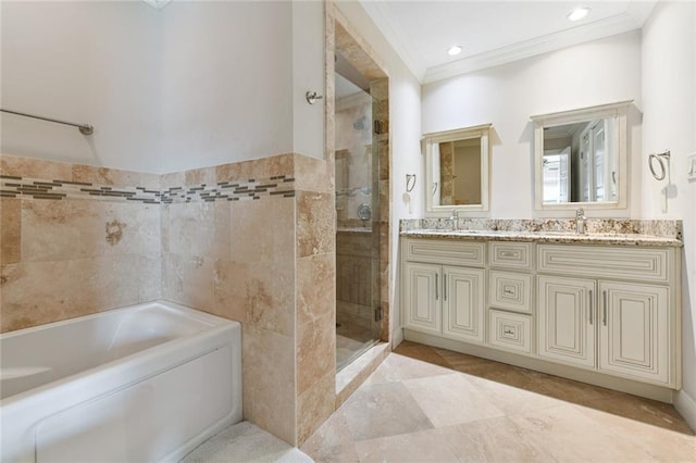 5517 N Rampart St, New Orleans, LA 70117 - bathroom with crown molding, a shower stall, a garden tub, double vanity, and recessed lighting