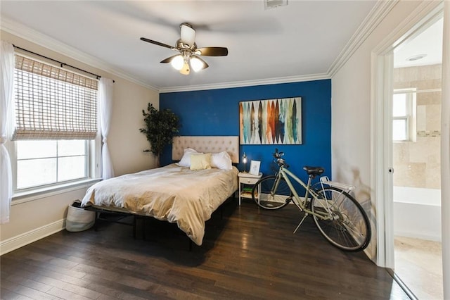 5517 N Rampart St, New Orleans, LA 70117 - bedroom featuring hardwood / wood-style flooring, baseboards, crown molding, ceiling fan, and connected bathroom