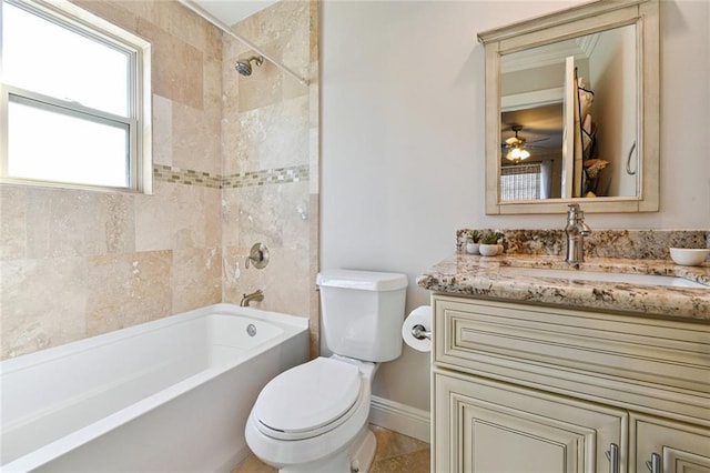 5517 N Rampart St, New Orleans, LA 70117 - full bath with toilet, vanity, tub / shower combination, baseboards, and a ceiling fan