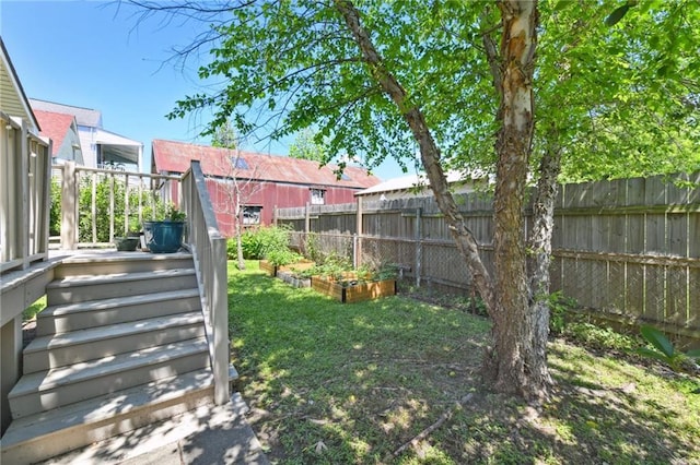 5517 N Rampart St, New Orleans, LA 70117 - view of yard with a vegetable garden and a wooden deck