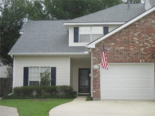57 Elizabeth Ct, Mandeville, LA 70448 - view of front of house featuring driveway, a shingled roof, a garage, brick siding, and a front yard