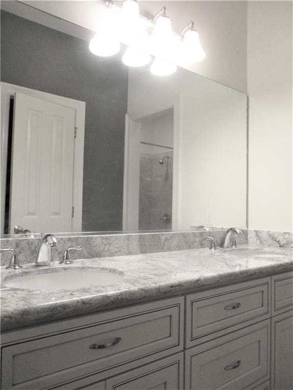 57 Elizabeth Ct, Mandeville, LA 70448 - bathroom with a shower and double vanity