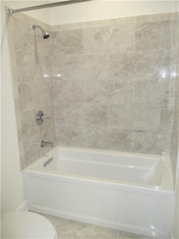 57 Elizabeth Ct, Mandeville, LA 70448 - bathroom featuring toilet, shower / washtub combination, and tile patterned flooring