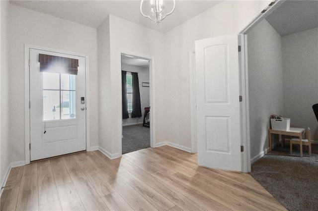 entryway featuring light wood finished floors and baseboards
