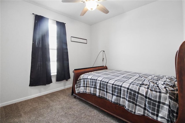 carpeted bedroom featuring baseboards and ceiling fan