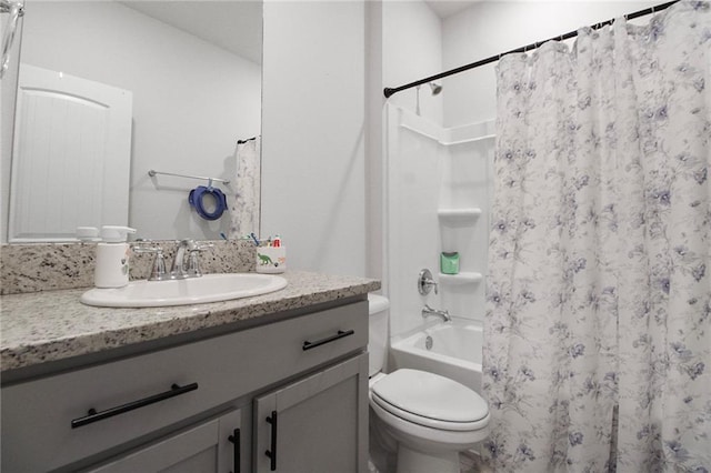 bathroom with toilet, shower / bath combo with shower curtain, and vanity