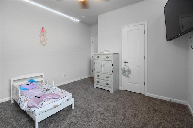bedroom with carpet, baseboards, and ceiling fan