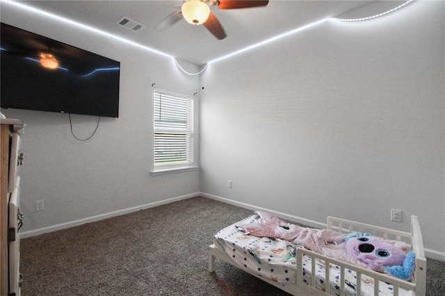 bedroom featuring carpet, baseboards, and a ceiling fan