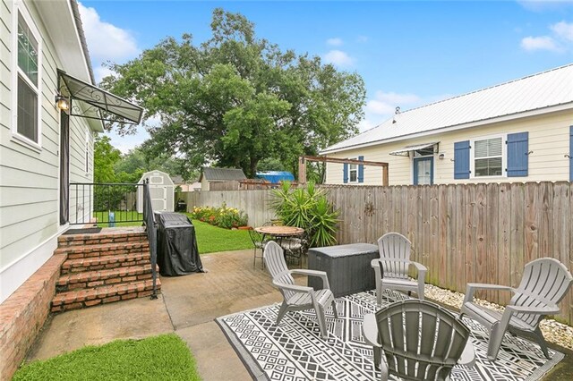 722 Luling Ave, Luling, LA 70070 - view of patio with a shed, a fenced backyard, and an outdoor structure
