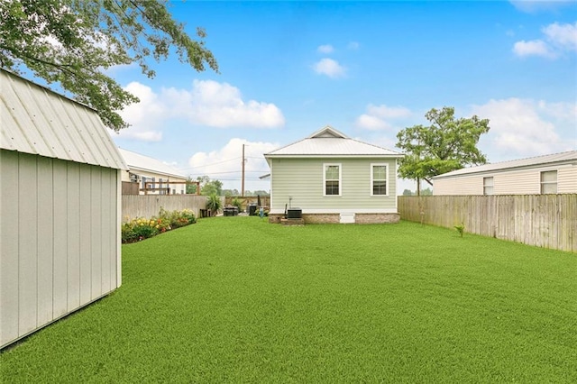 722 Luling Ave, Luling, LA 70070 - back of house with central air condition unit and an outdoor structure