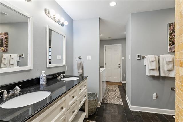 3451 Constance St, New Orleans, LA 70115 - full bathroom with recessed lighting, double vanity, and baseboards