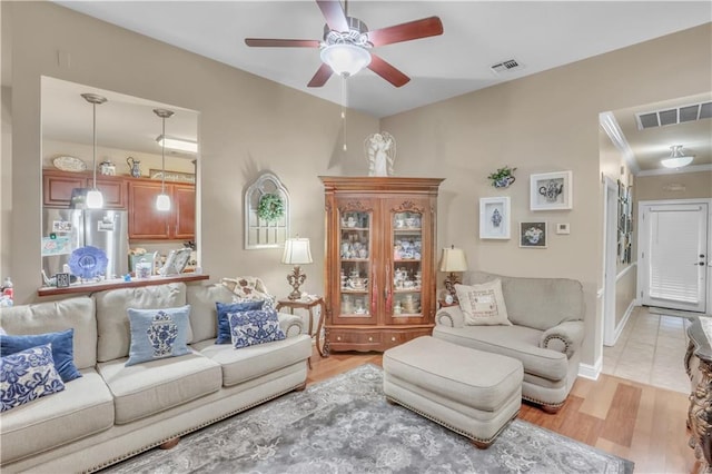 270 Libra Ave Unit B, Mandeville, LA 70471 - living room with ceiling fan and light wood-style flooring