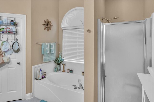 270 Libra Ave Unit B, Mandeville, LA 70471 - full bathroom with a shower stall and a garden tub