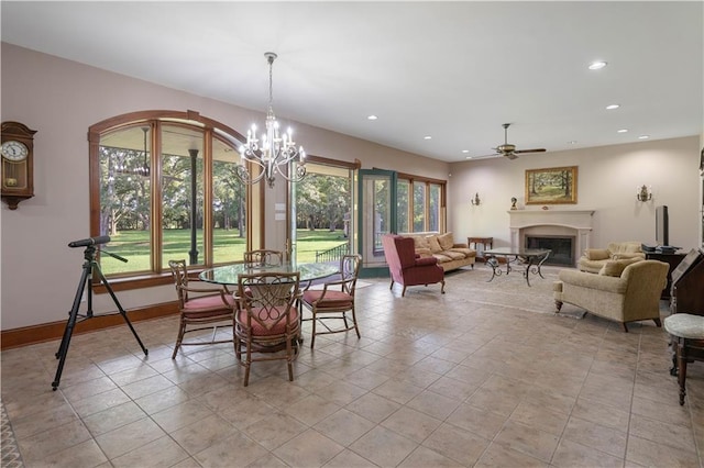 22450 Elderberry Ln, Bush, LA 70431 - dining room with a fireplace, a chandelier, ceiling fan, recessed lighting, and baseboards