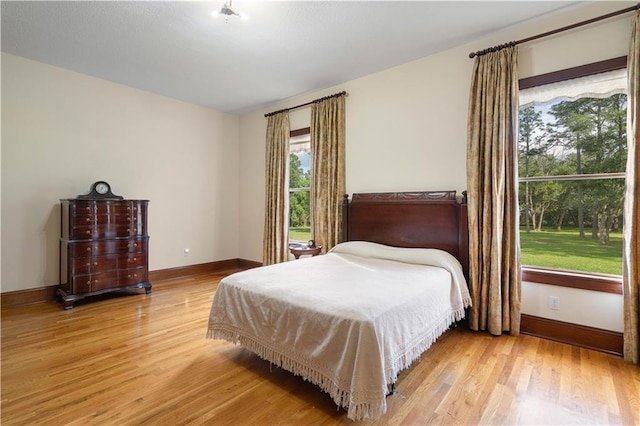 22450 Elderberry Ln, Bush, LA 70431 - bedroom with light wood finished floors and baseboards