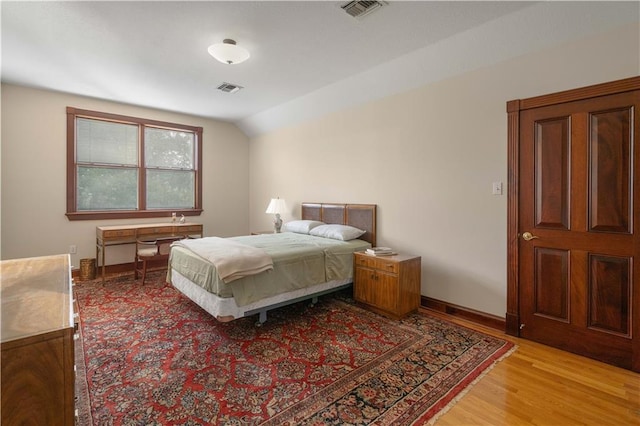 22450 Elderberry Ln, Bush, LA 70431 - bedroom with light wood finished floors, lofted ceiling, and baseboards