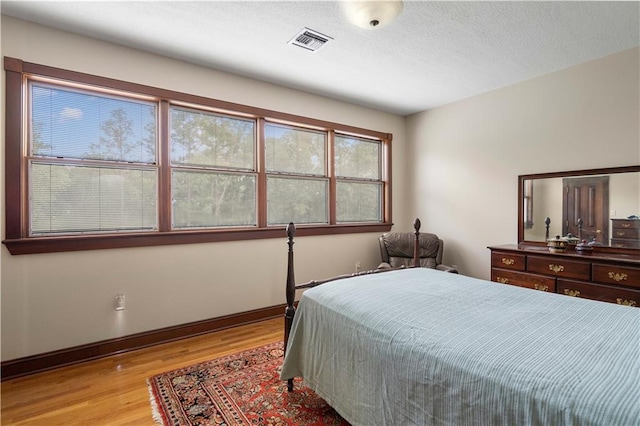 22450 Elderberry Ln, Bush, LA 70431 - bedroom featuring light wood finished floors and baseboards