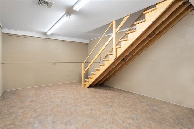 22450 Elderberry Ln, Bush, LA 70431 - finished below grade area featuring stairs and concrete block wall