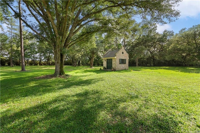 22450 Elderberry Ln, Bush, LA 70431 - view of grassy yard featuring an outbuilding and a storage unit
