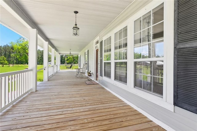 wooden terrace featuring a porch