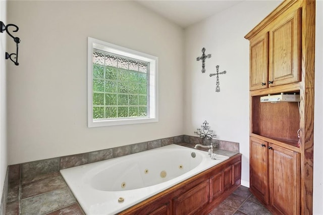 bathroom featuring a tub with jets