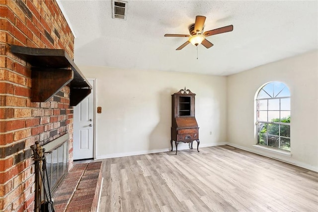 114 Pitre St, Saint Rose, LA 70087 - unfurnished living room featuring a ceiling fan, wood finished floors, baseboards, and a textured ceiling