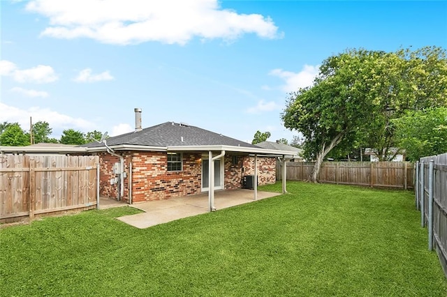 114 Pitre St, Saint Rose, LA 70087 - back of property with a patio, brick siding, and a shingled roof