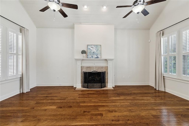993 Beauregard Pkwy, Covington, LA 70433 - unfurnished living room featuring a ceiling fan, a premium fireplace, lofted ceiling, wood finished floors, and crown molding