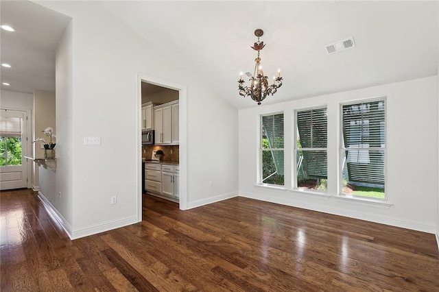 993 Beauregard Pkwy, Covington, LA 70433 - unfurnished dining area with a chandelier, baseboards, dark wood-style floors, recessed lighting, and lofted ceiling