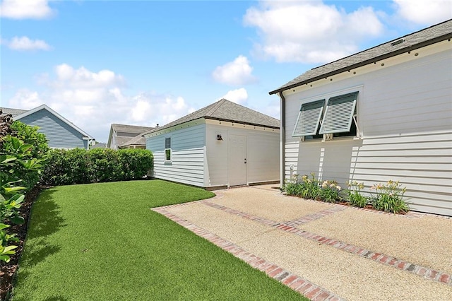 993 Beauregard Pkwy, Covington, LA 70433 - view of grassy yard with an outdoor structure and a patio