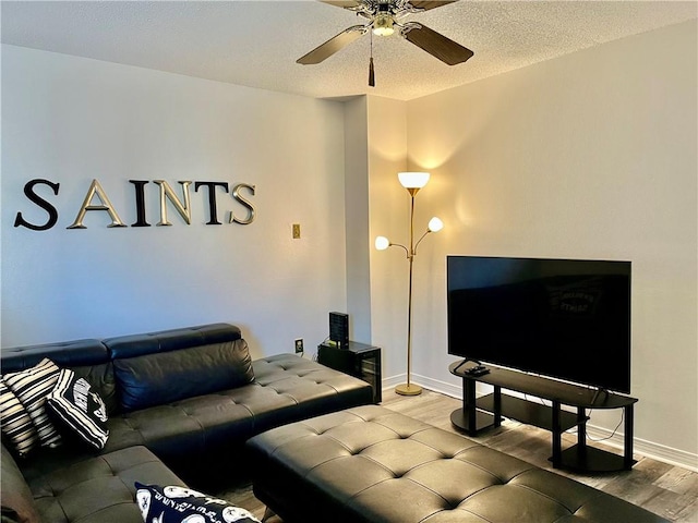1500 W Esplanade Ave Unit 3-B, Kenner, LA 70065 - living area featuring wood finished floors, a ceiling fan, a textured ceiling, and baseboards