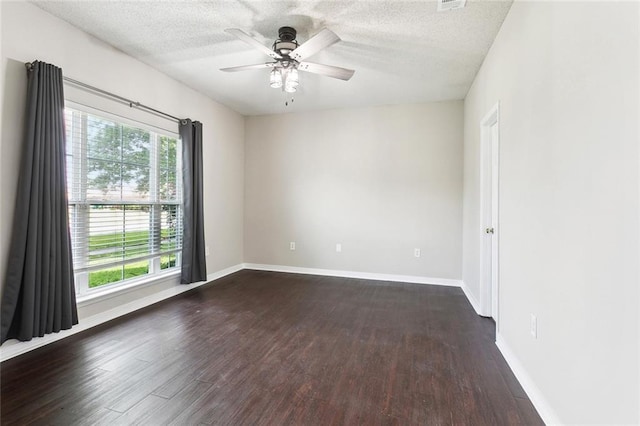 1902 Huey P Long Ave, Gretna, LA 70053 - empty room featuring dark wood-style flooring, a textured ceiling, ceiling fan, and baseboards