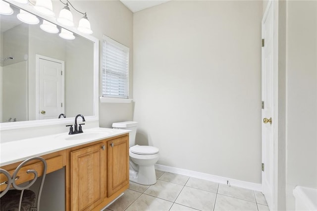 1902 Huey P Long Ave, Gretna, LA 70053 - full bath with tile patterned floors, toilet, vanity, and baseboards