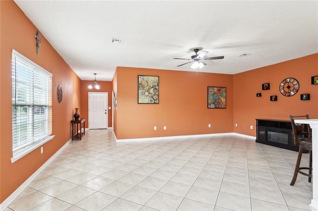 1902 Huey P Long Ave, Gretna, LA 70053 - unfurnished living room featuring a ceiling fan, light tile patterned floors, and baseboards